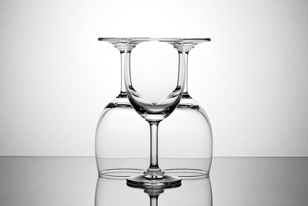 three clear wine glasses