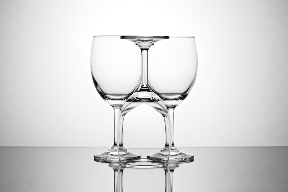 pair of clear glass wine goblets