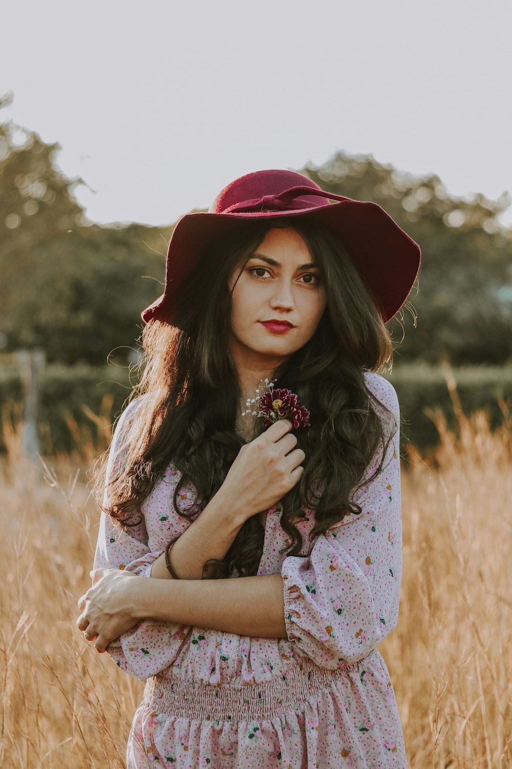 woman on brown grass field during daytime