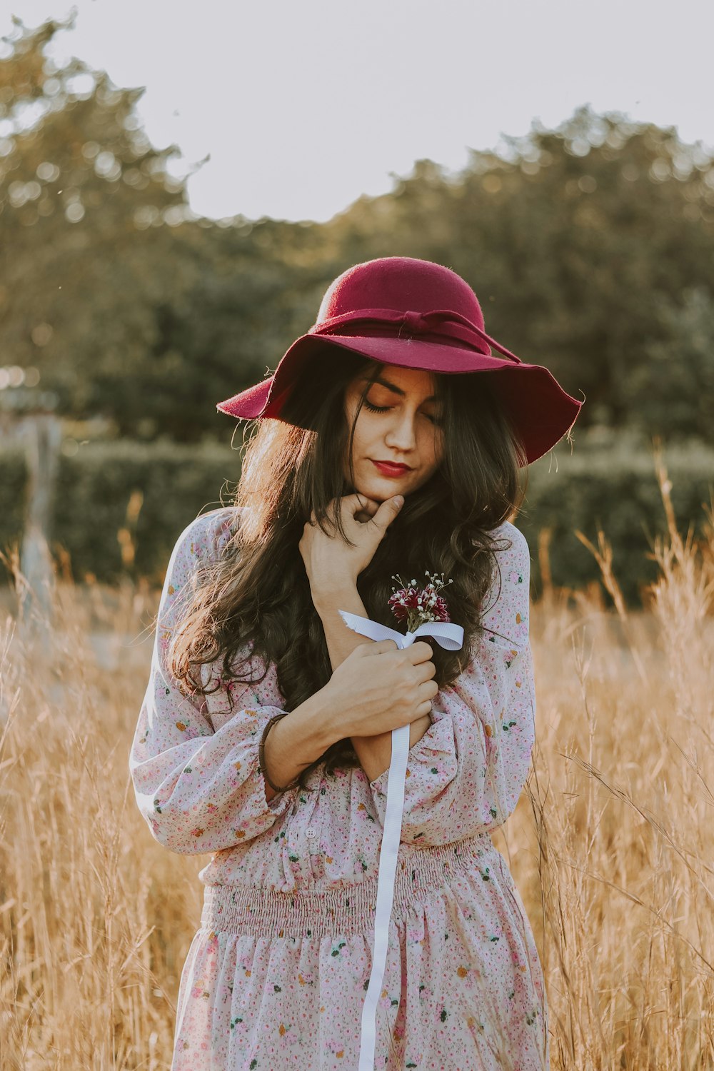 woman wearing brown floral long-sleeved dress