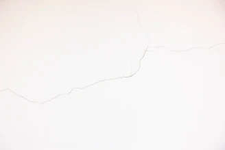 A smooth drywall wall after crack repair, showing no visible damage.