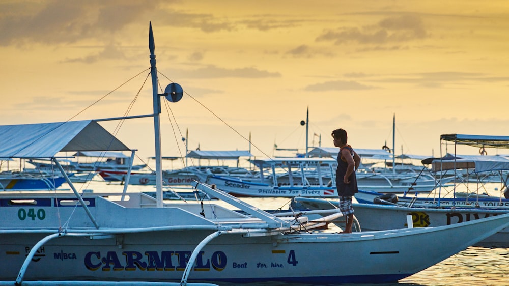 person standing on boat