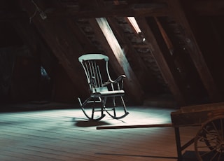 rocking chair on attic near window