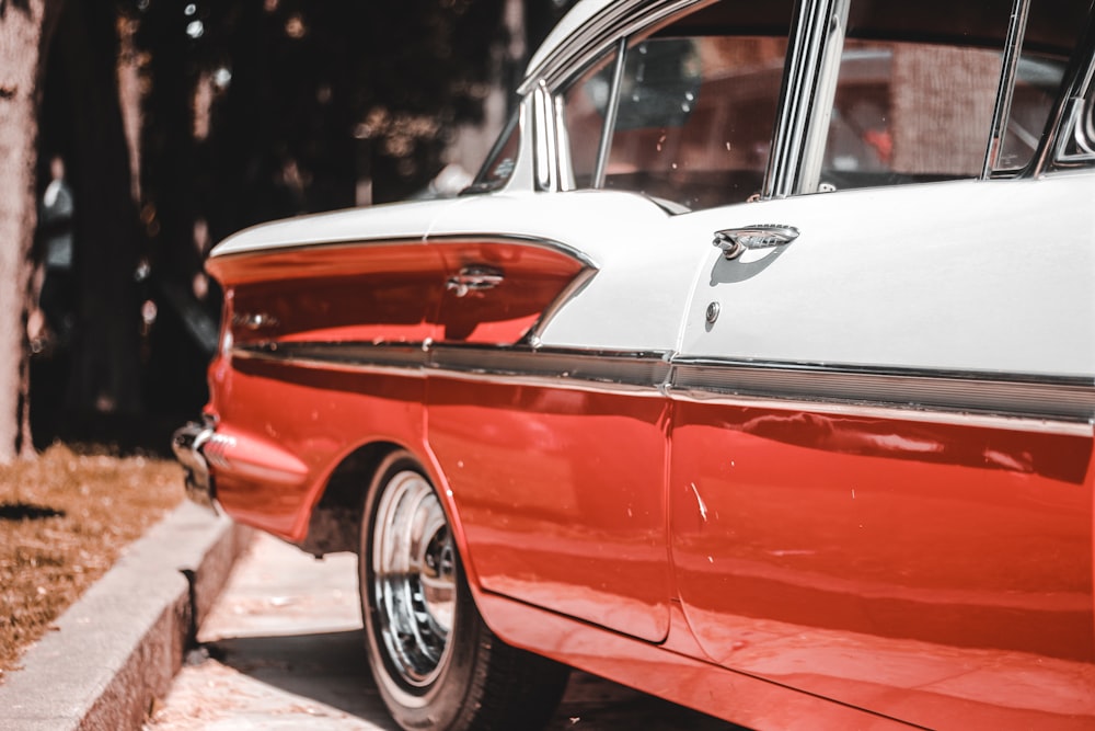 classic orange car on road