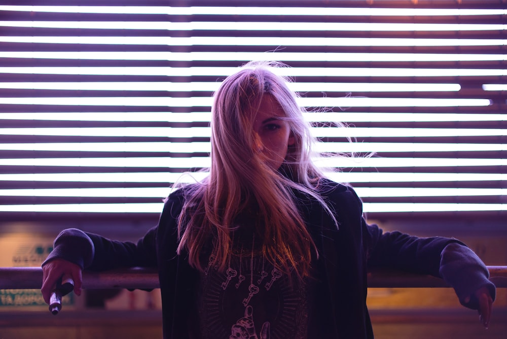 woman leaning on rails