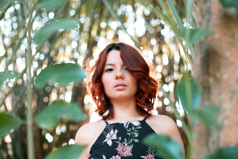 woman standing under tree