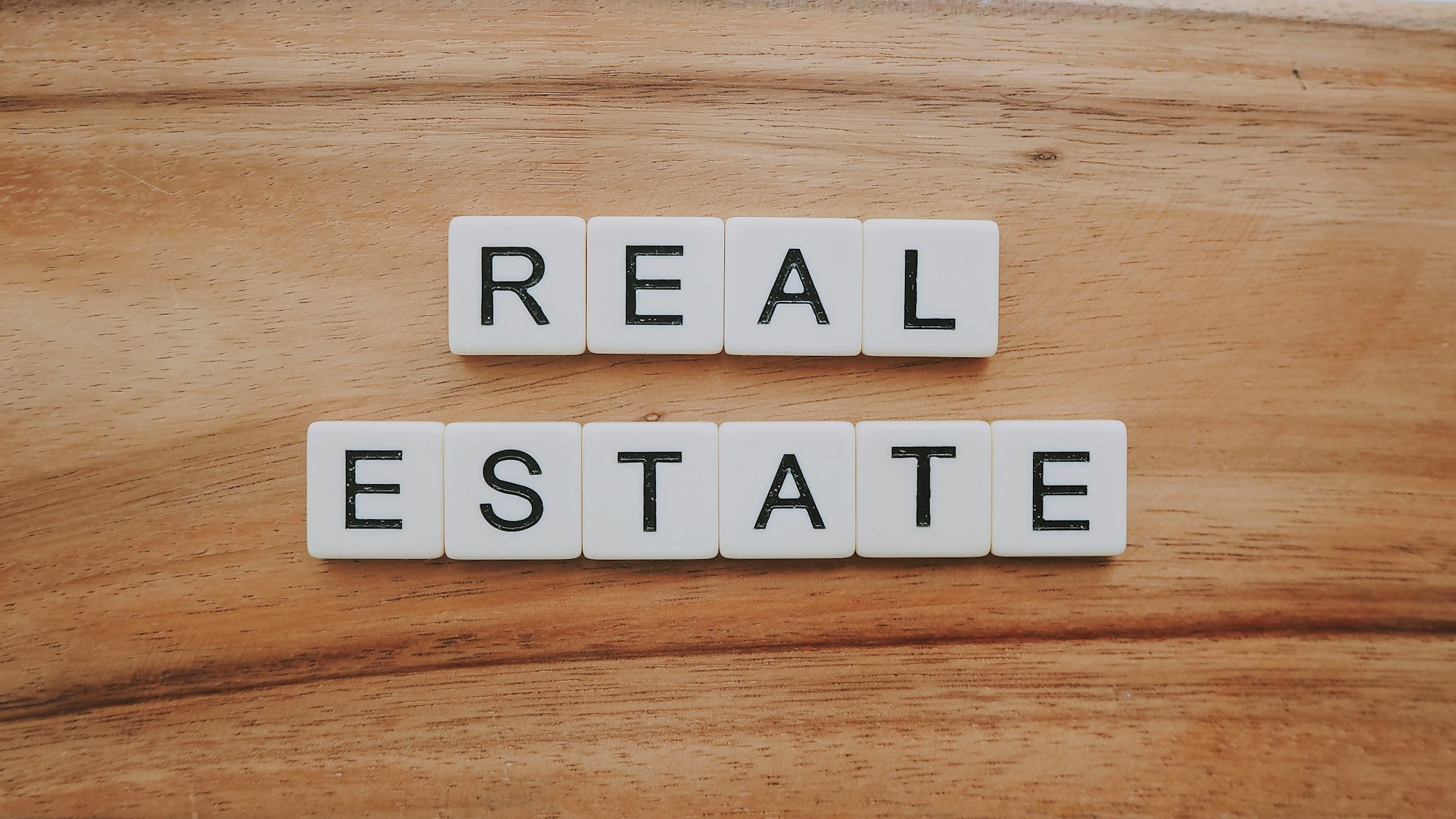 Real estate spelled out in letter blocks.