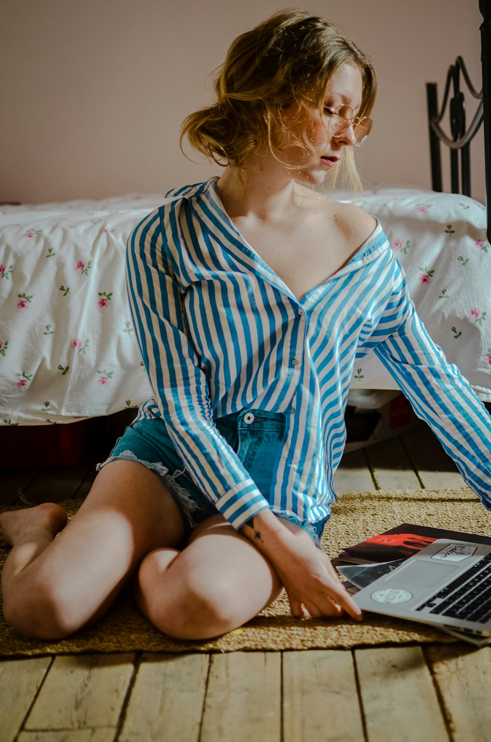 woman sitting on area rug