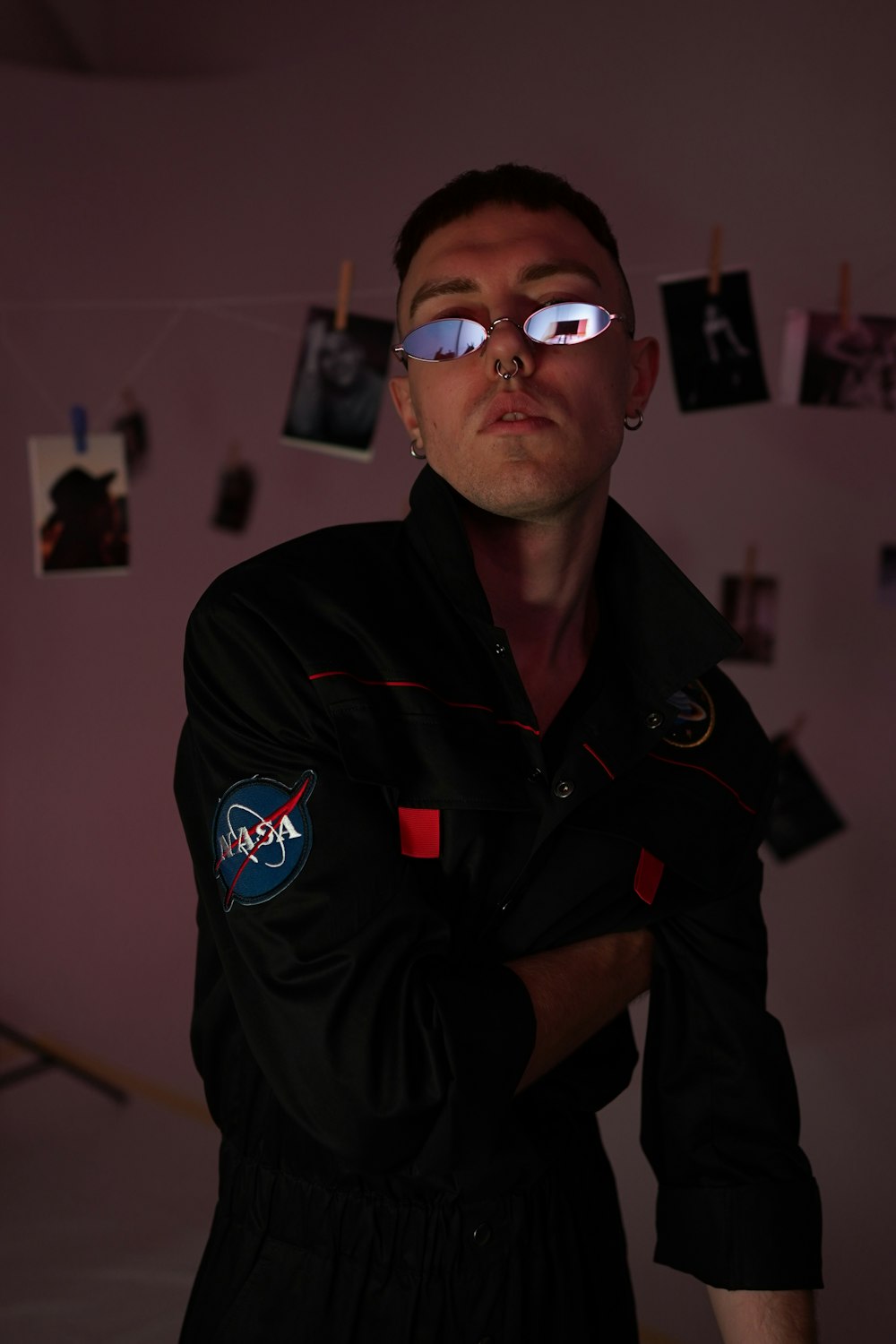 man in black jumpsuit standing inside room