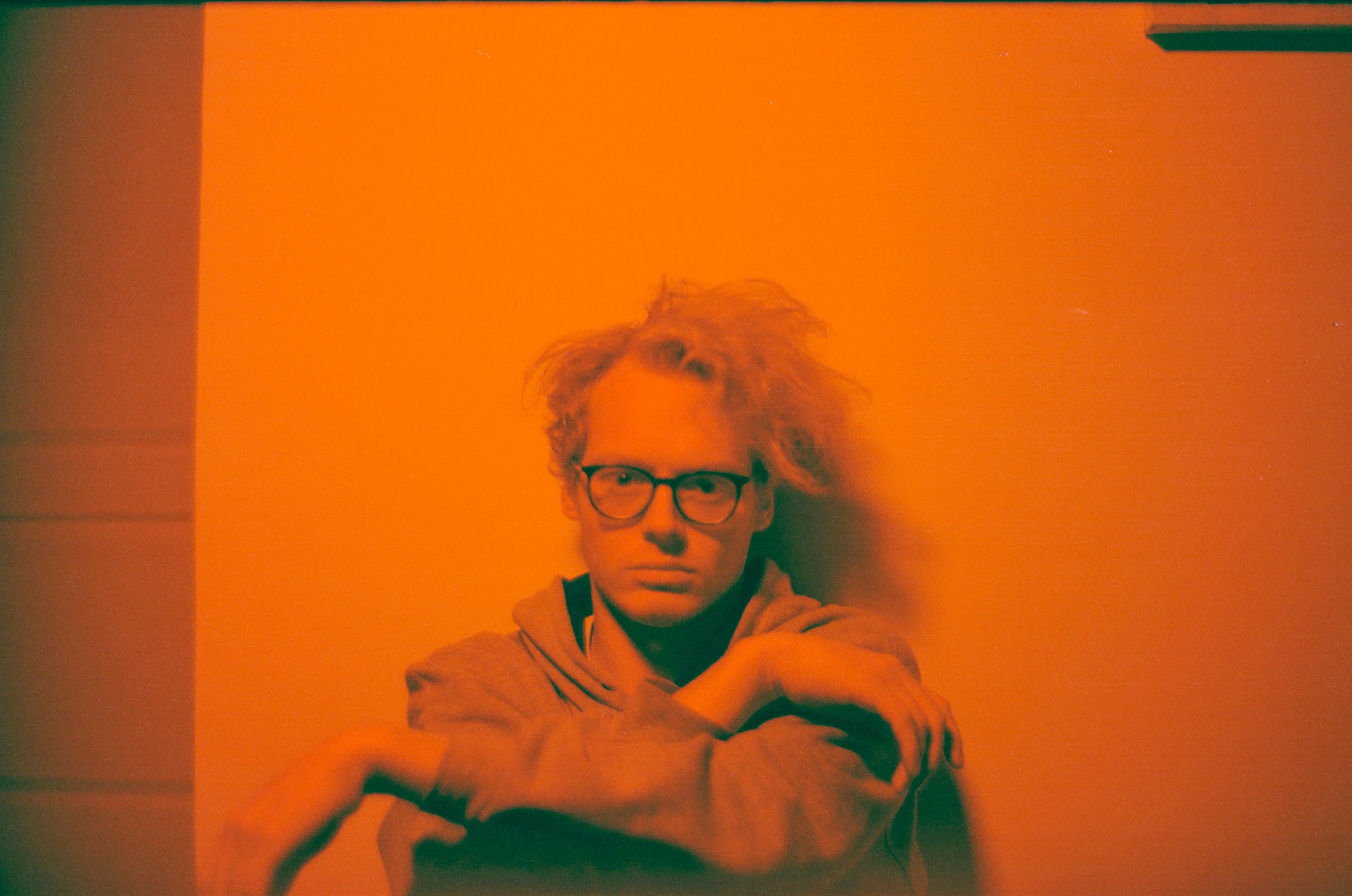 Man Sitting On The Floor Against The Wall Photo Free Human Image