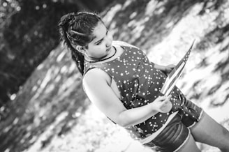 A confident adolescent girl holding a flag, symbolizing strength and commitment to health.
