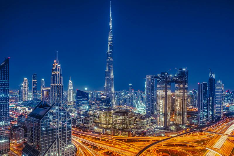 Burj Khalifa towering over the illuminated Dubai skyline