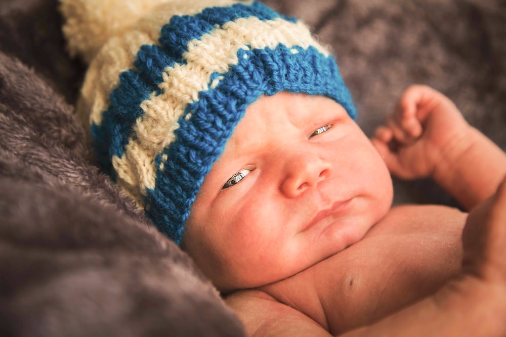 selective focus photo of newborn baby
