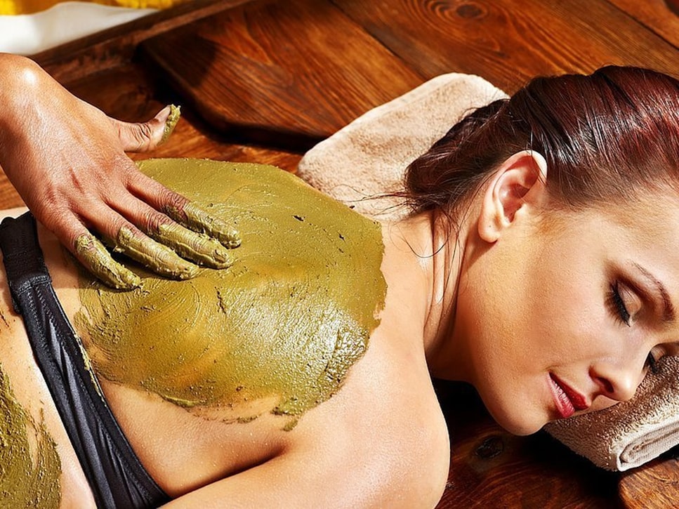 A lady undergoing an Ayurveda massage session 