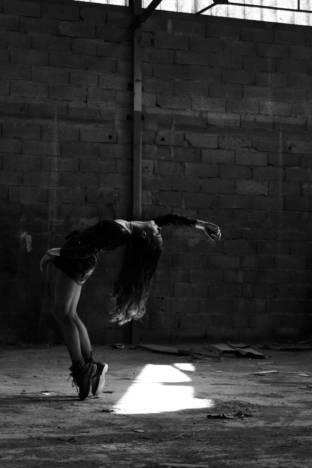 woman dancing at the empty warehouse