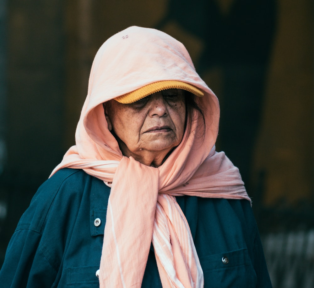 woman wearing pink scarf