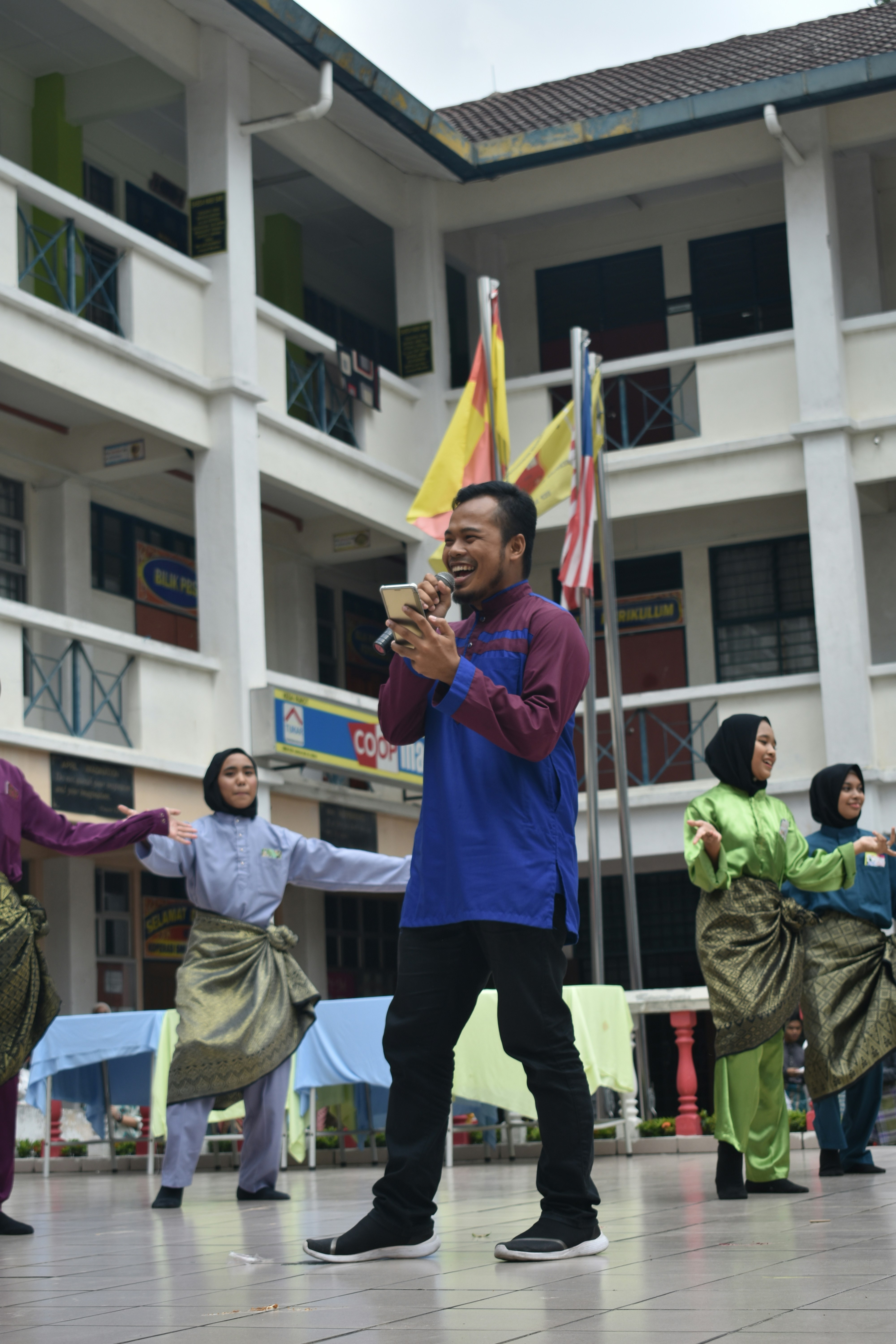Singer during Hari Raya celebration at a school