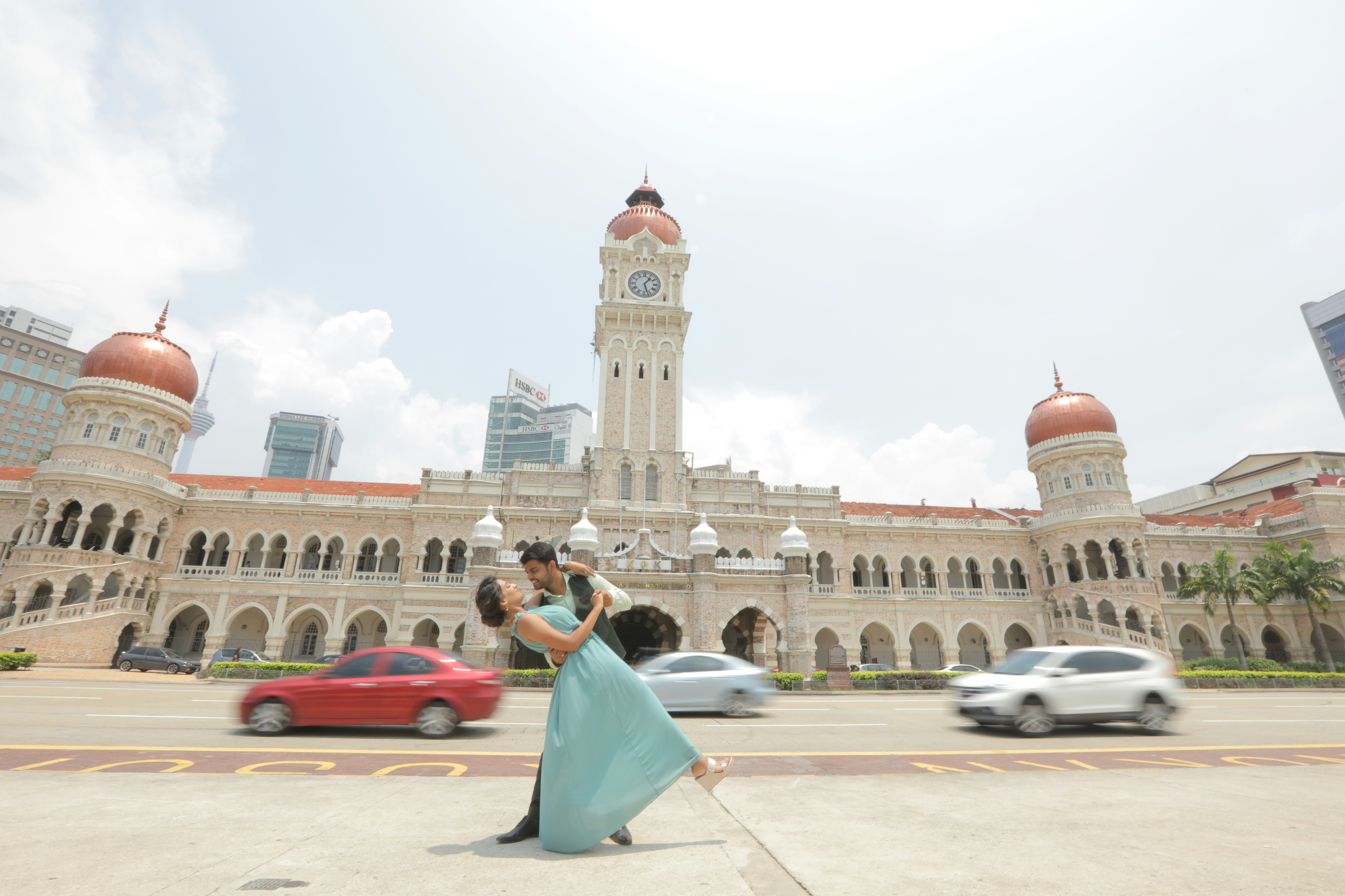 dancing man and woman in front of church