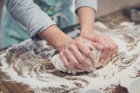 Emma Lawson kneading sourdough dough