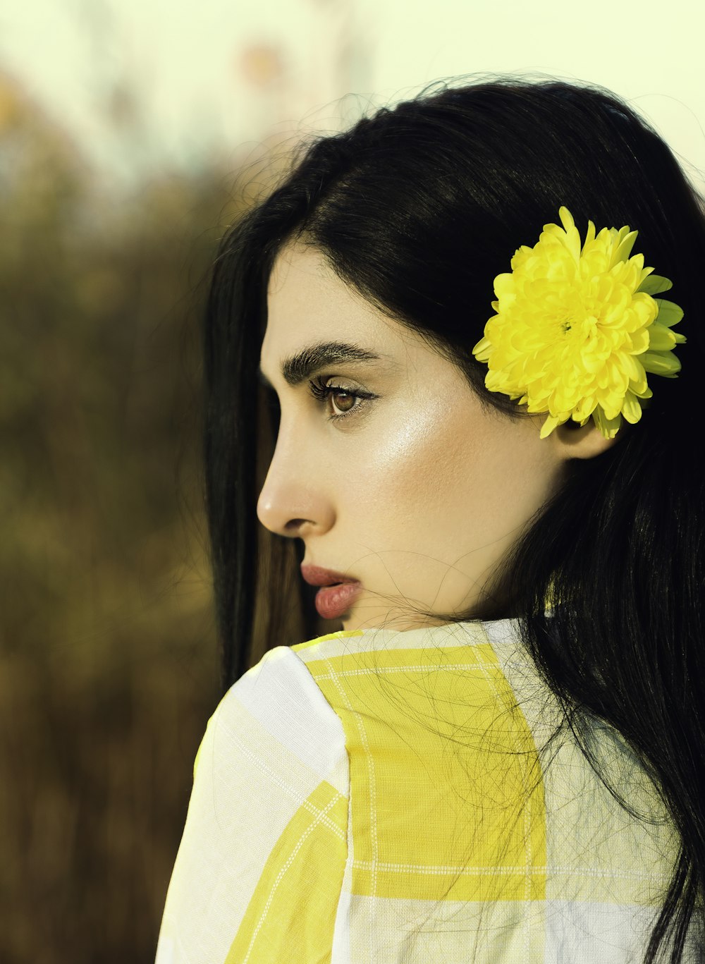 shallow focus photo of woman in white and yellow top
