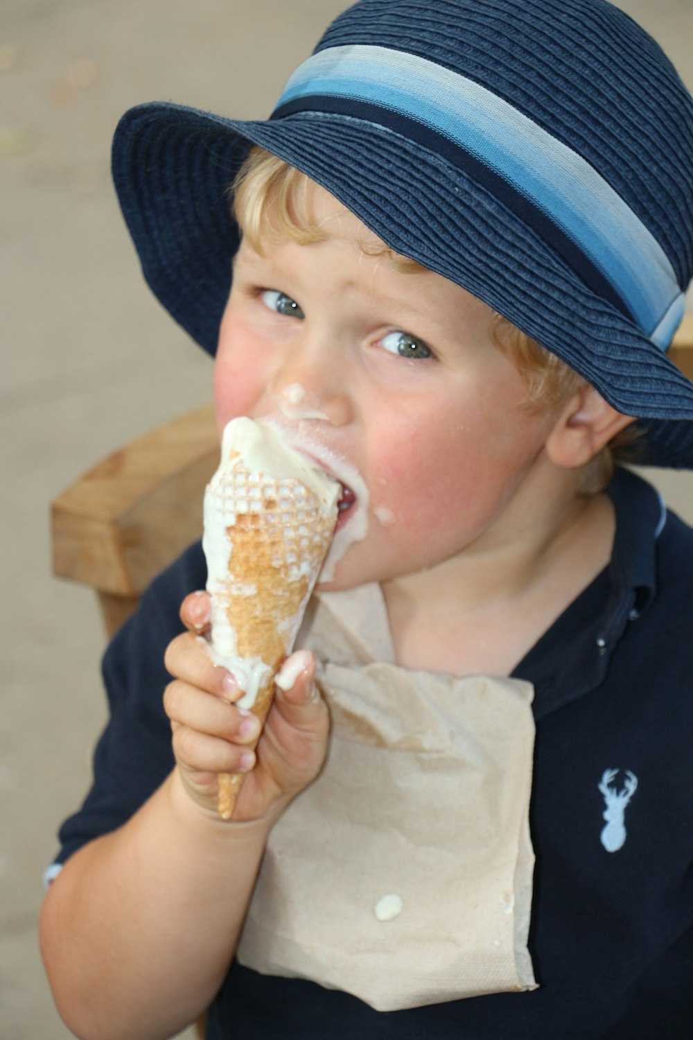 toddler eating ice cream with cone
