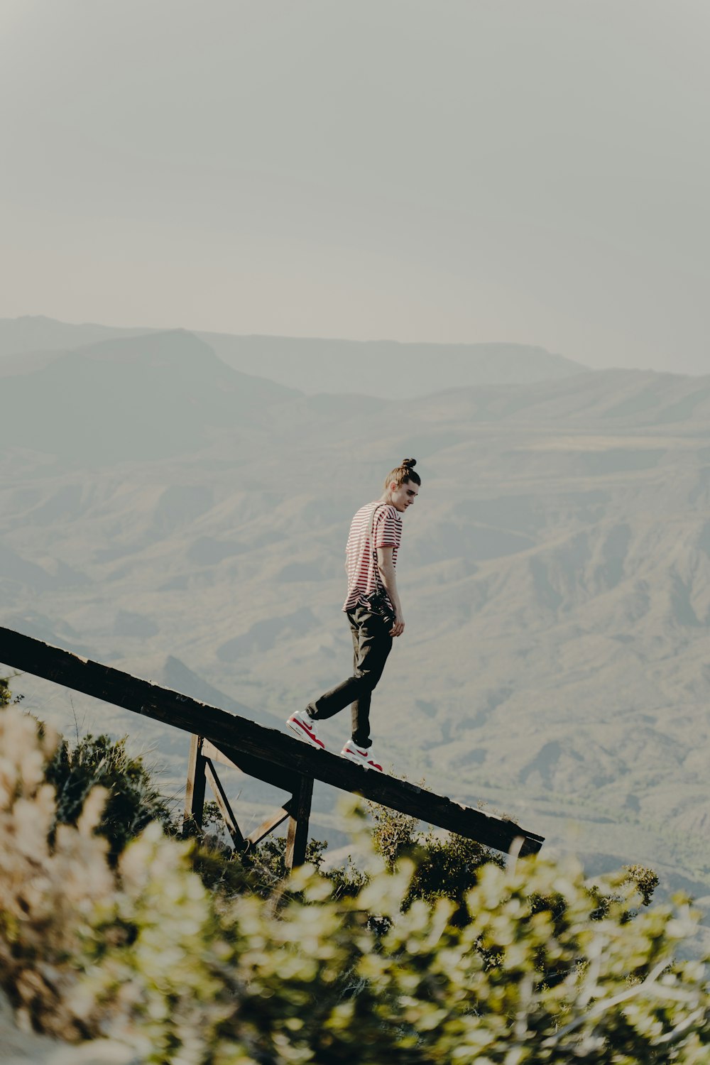 person walking near ledge during daytime