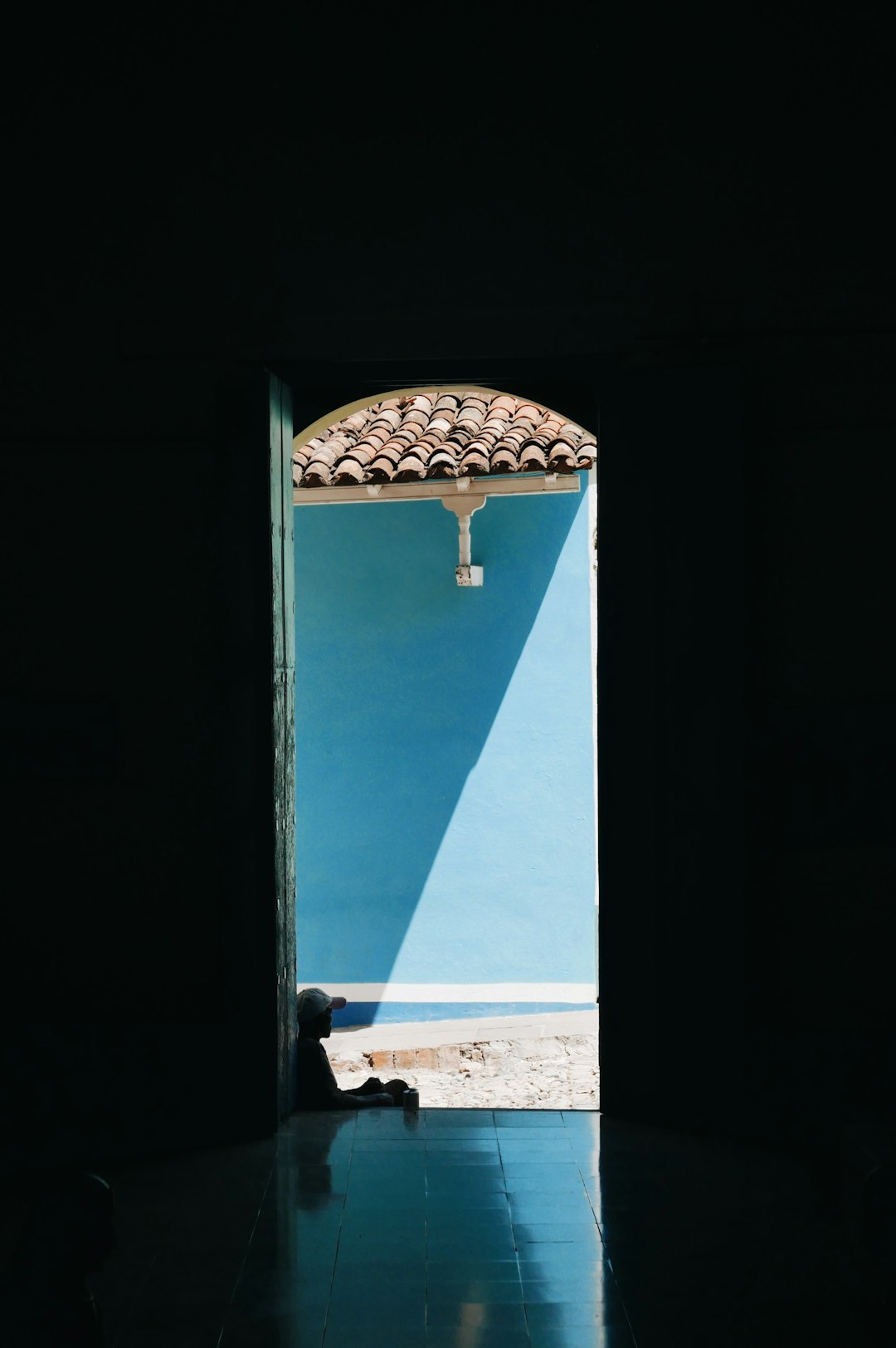 man sitting on front steps