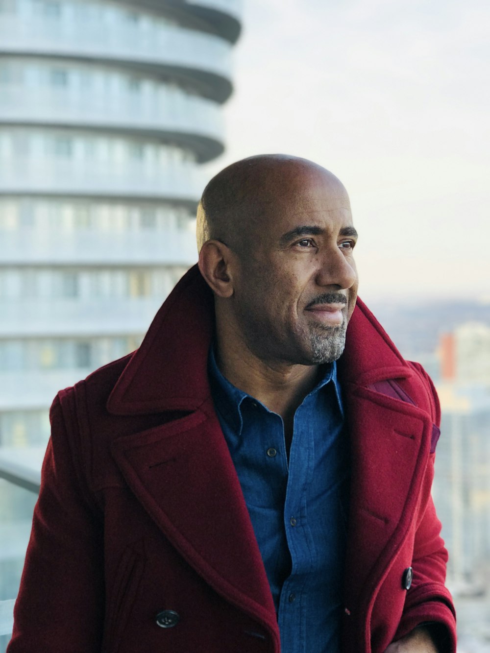 man wearing red double breasted coat