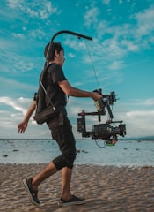 Behind-the-scenes of a content creator filming UGC on a sunny beach.
