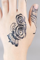 A close-up of traditional mehendi designs on a hand, highlighting cultural artistry.
