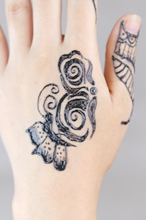 A close-up of intricate mehendi designs on a bride's hands.