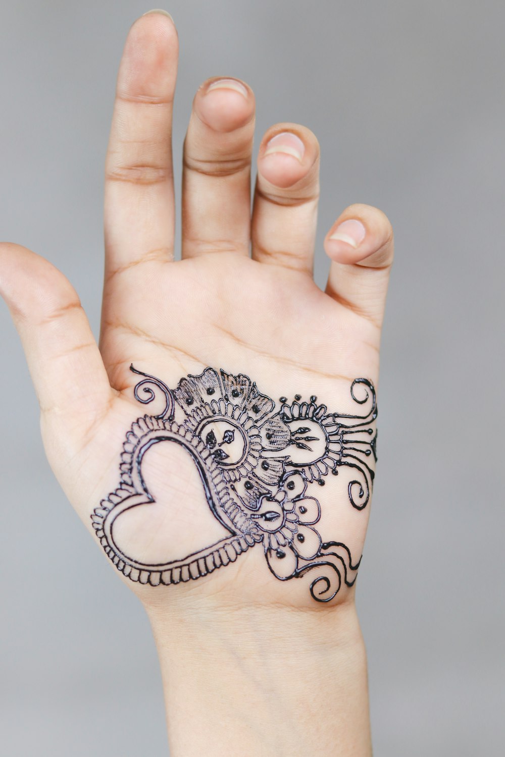 Left Person S Hand With Tattoo Photo Free Tattoo Image On Unsplash