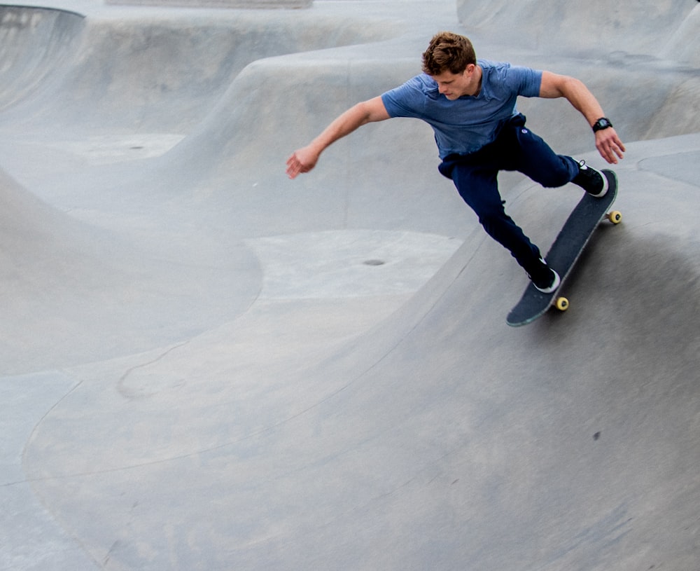 man skateboarding on ramp