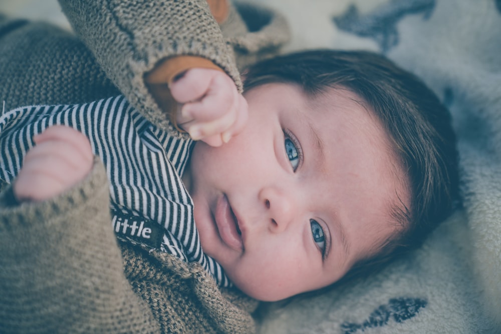 baby on bedspread