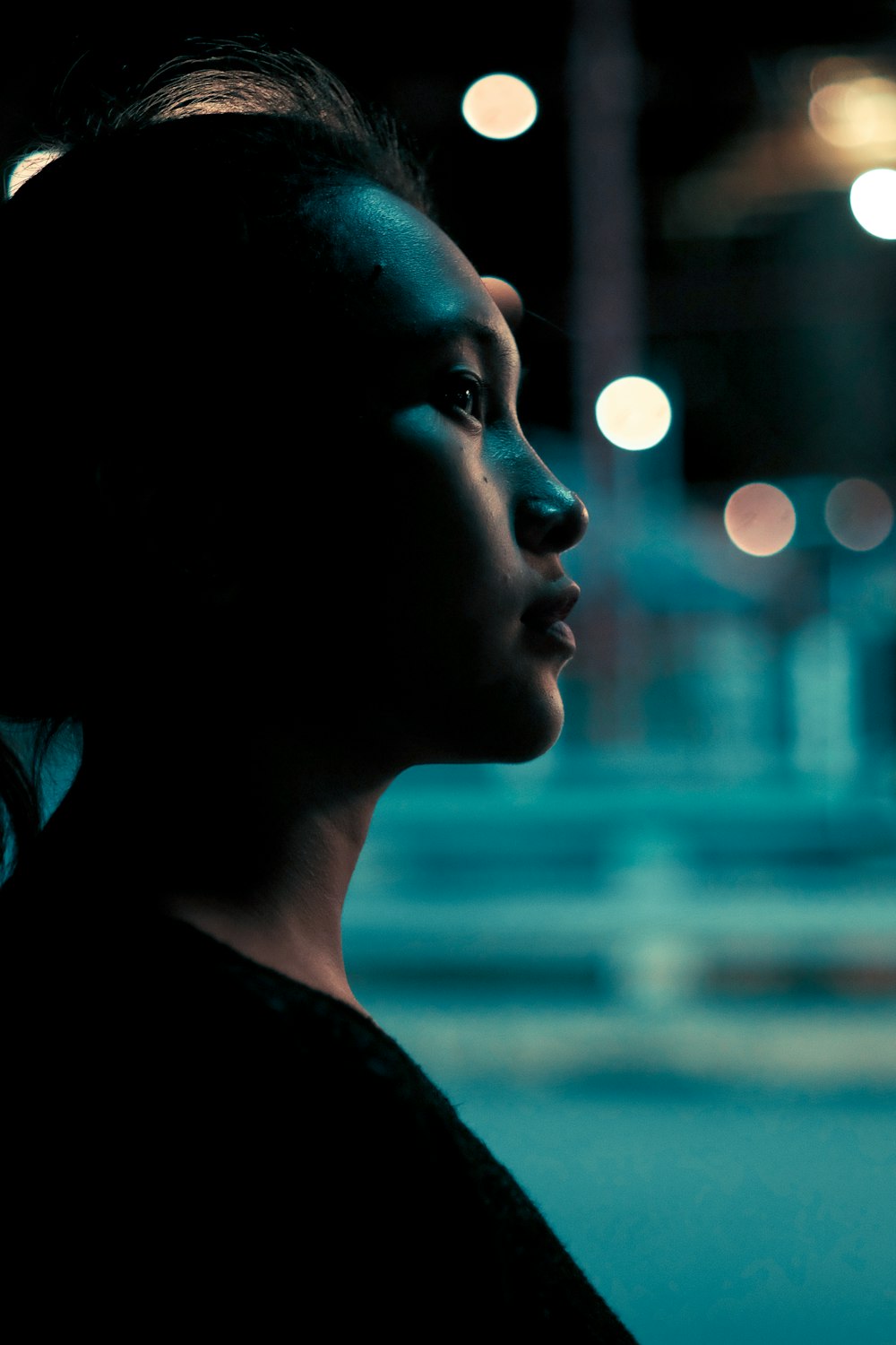 woman wearing black crew-neck top