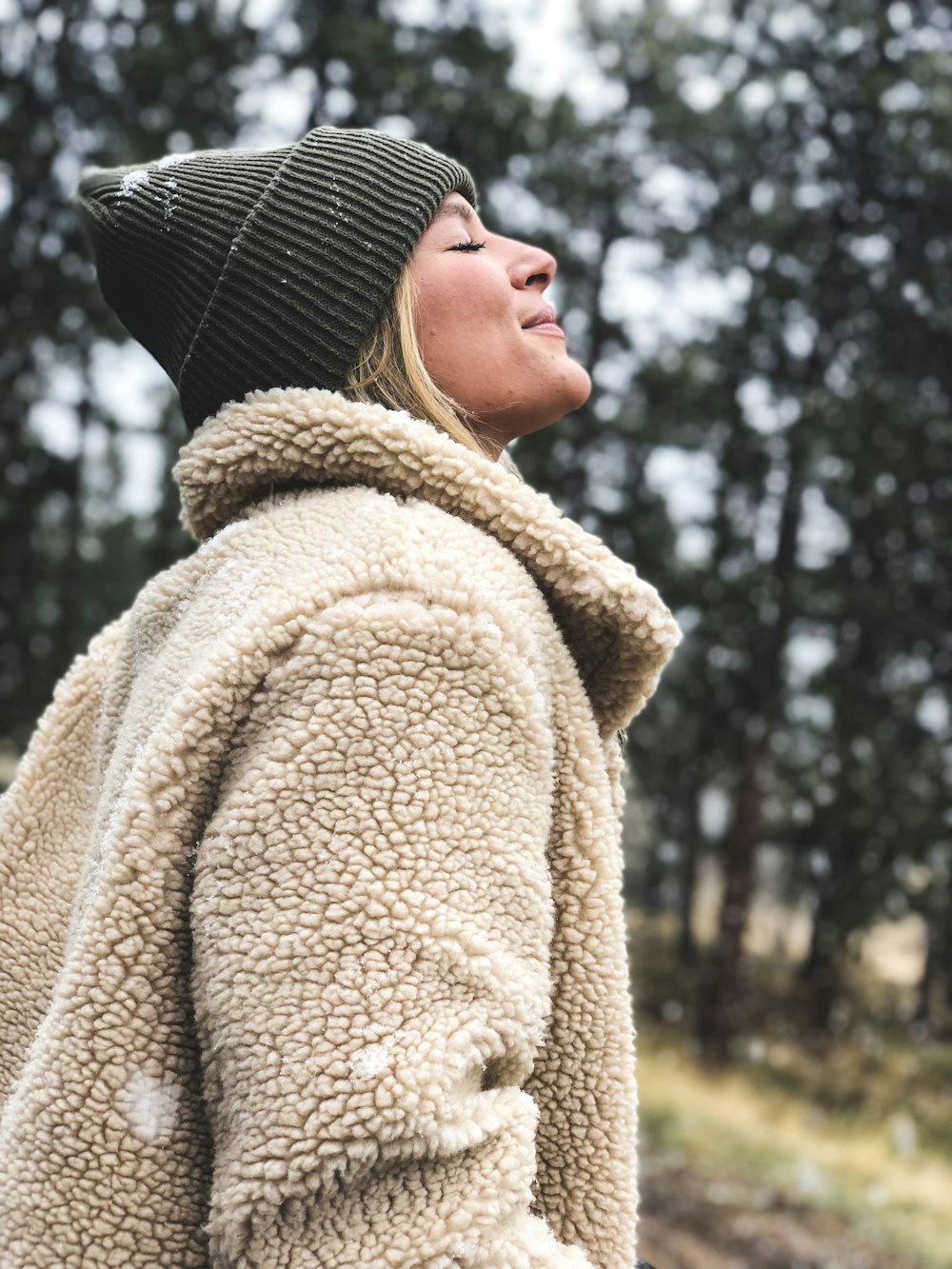 close-up photography of woman standing near outdoor during daytime