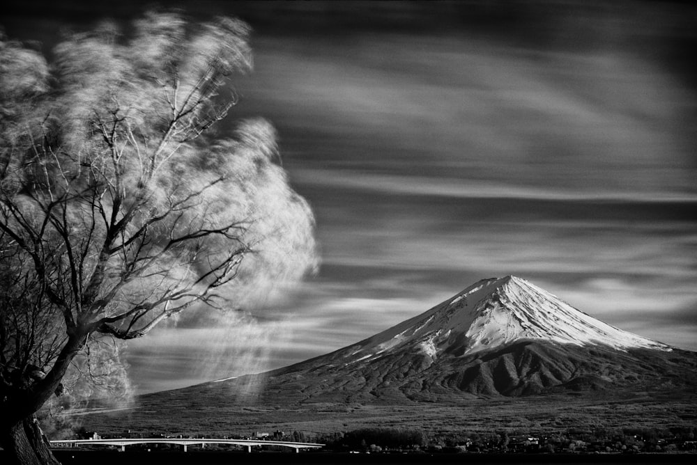 snow covered mountain black and white photo