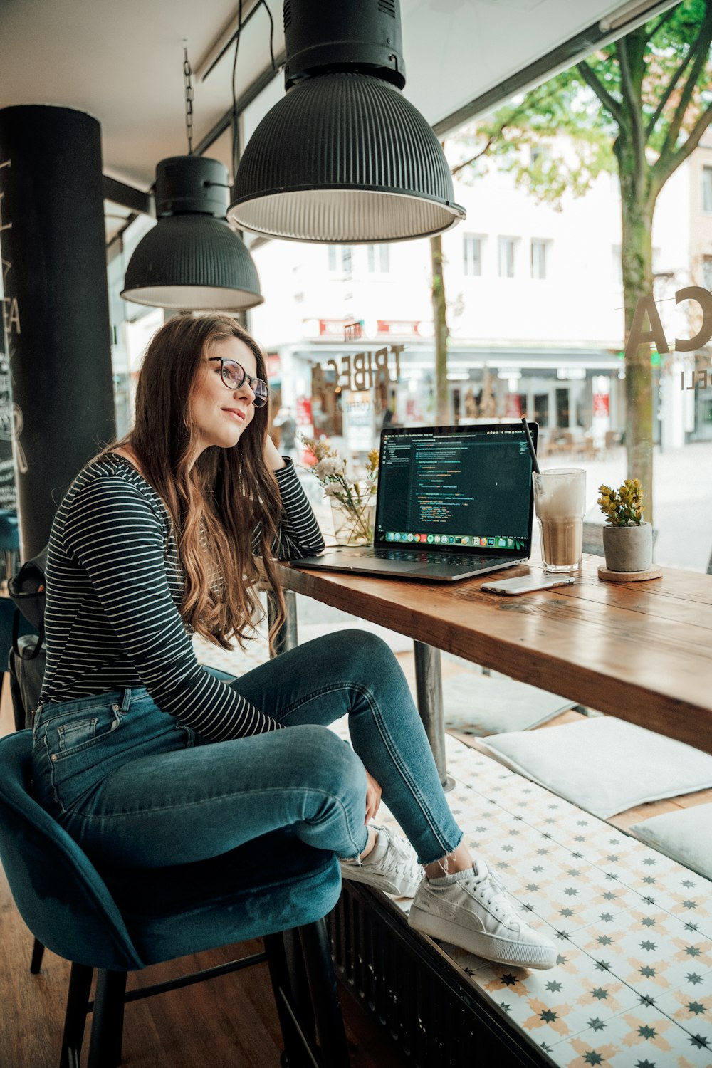 woman leaning at the table