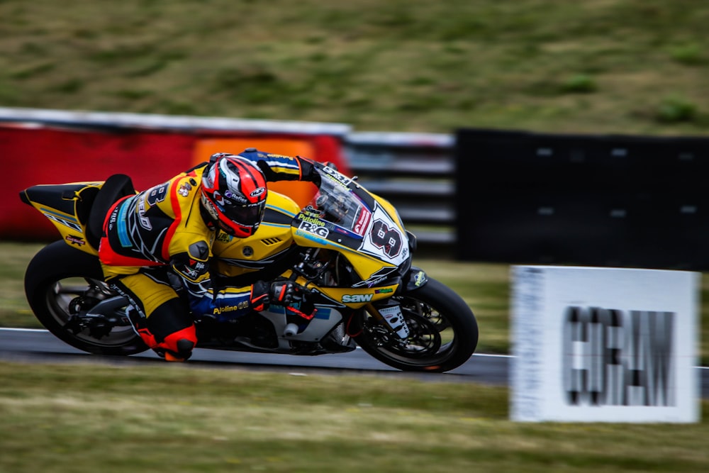 man racing riding motorcycle