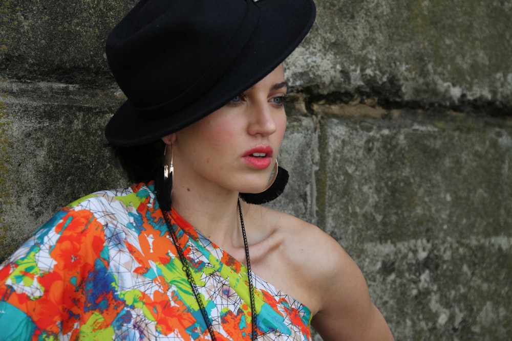 woman leaning on wall