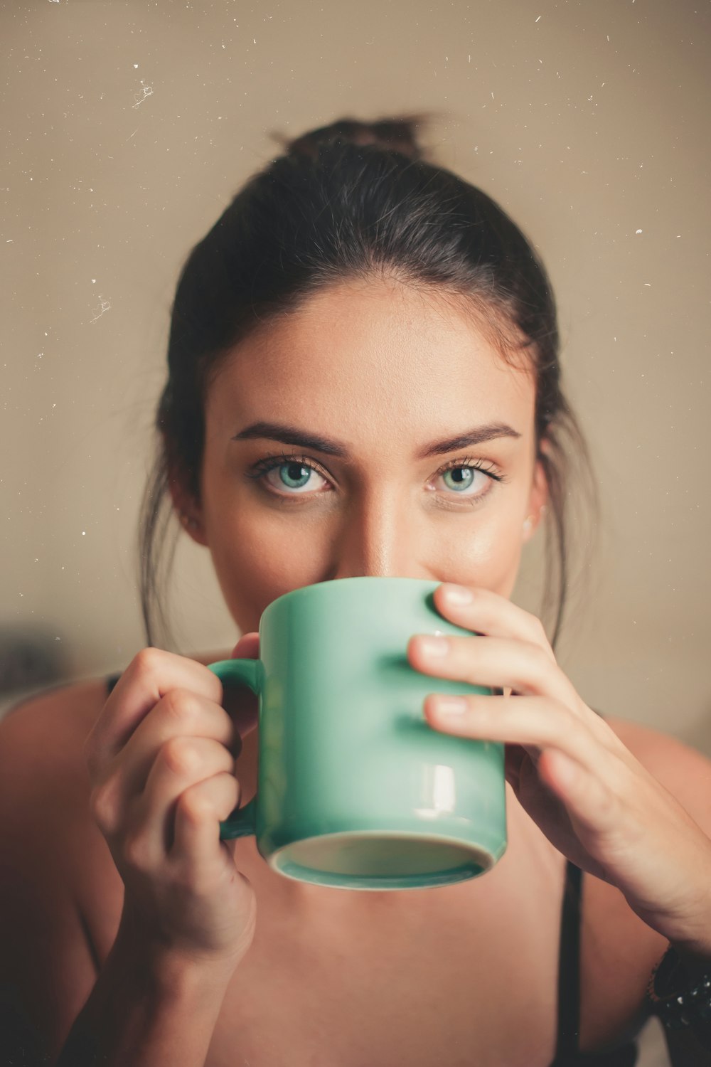 unknown person drinking indoors