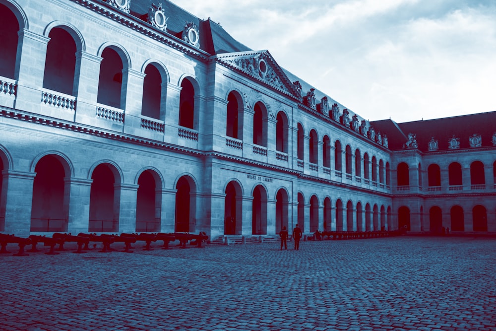 two person standing in front of buildings