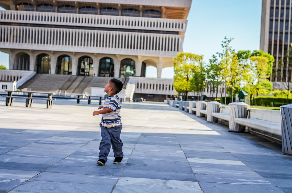 boy walking at the square