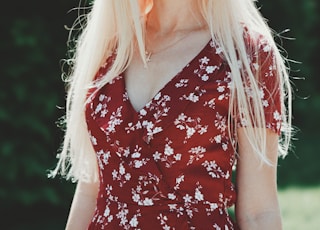 woman wearing red and white floral dress