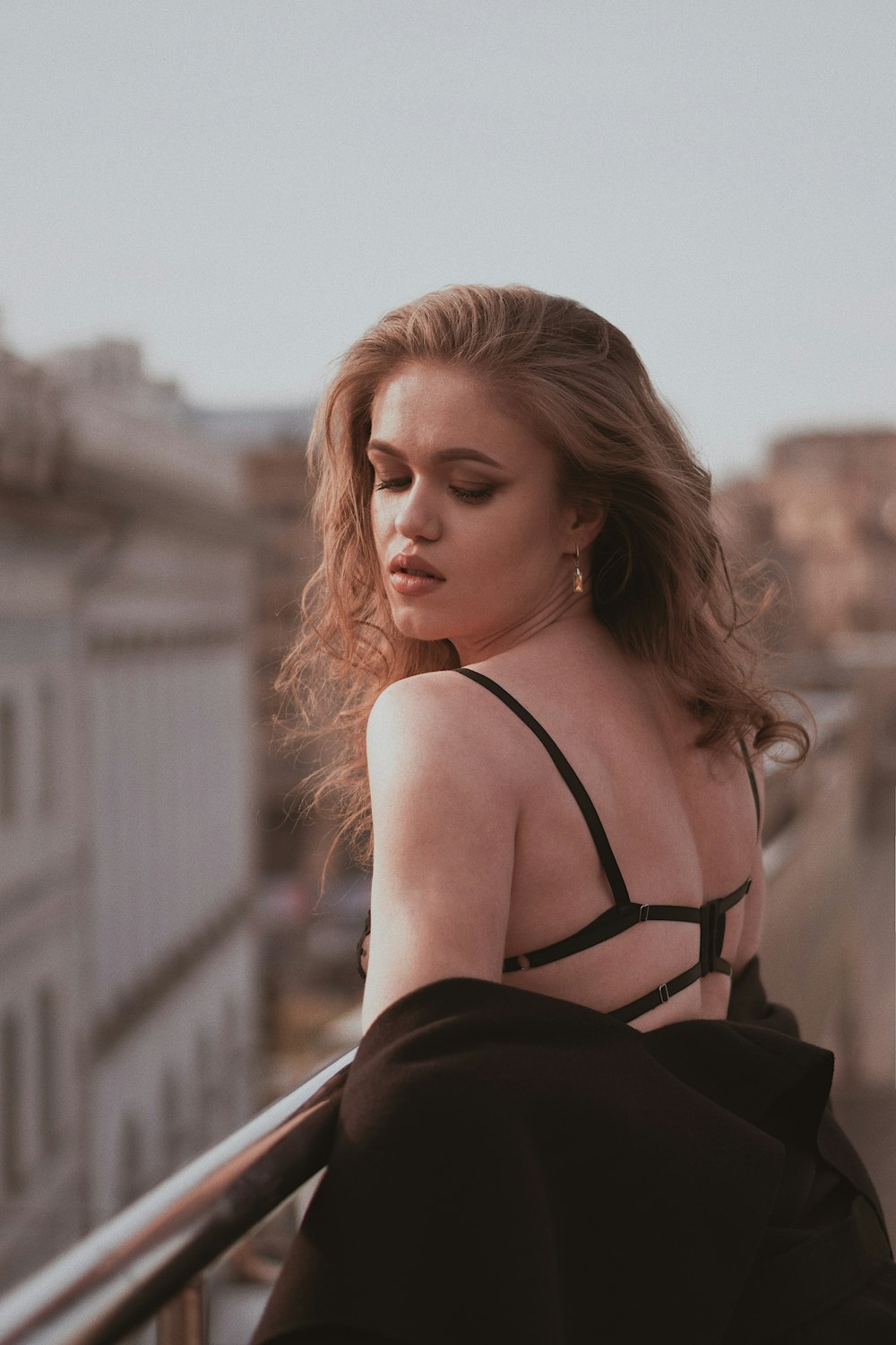 woman standing near railings