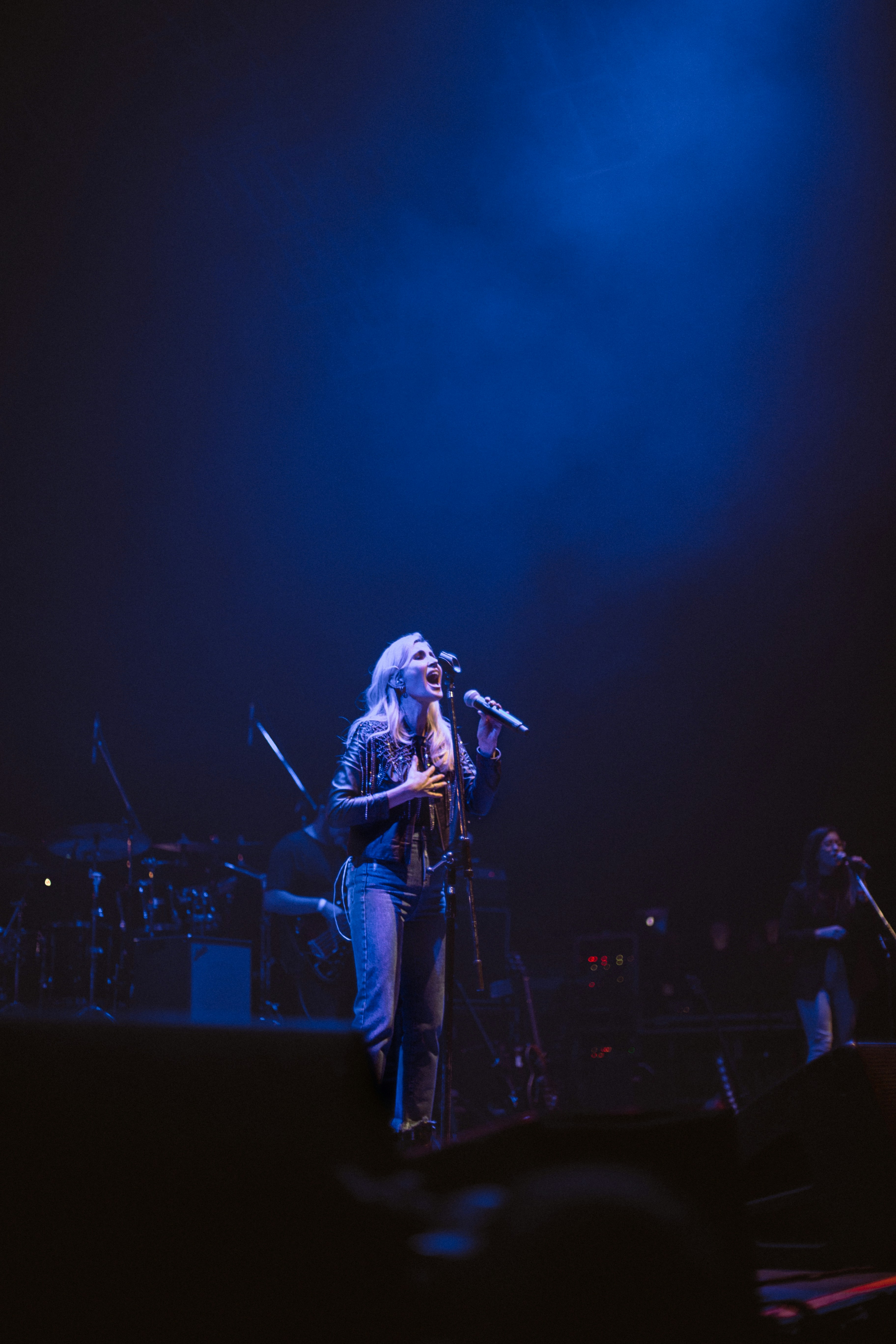woman performing on stage photo Free Blue Image on Unsplash