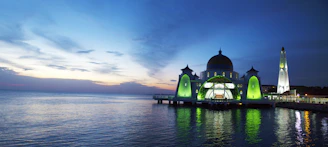 A serene digital rendering of a mosque glowing softly under a twilight sky.