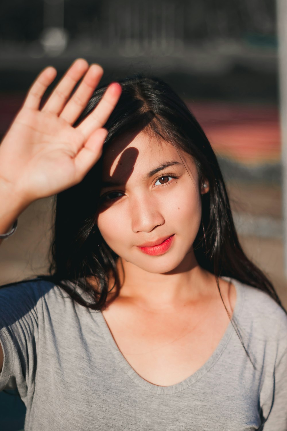 women wearing grey scoop neck shirt close-up photography