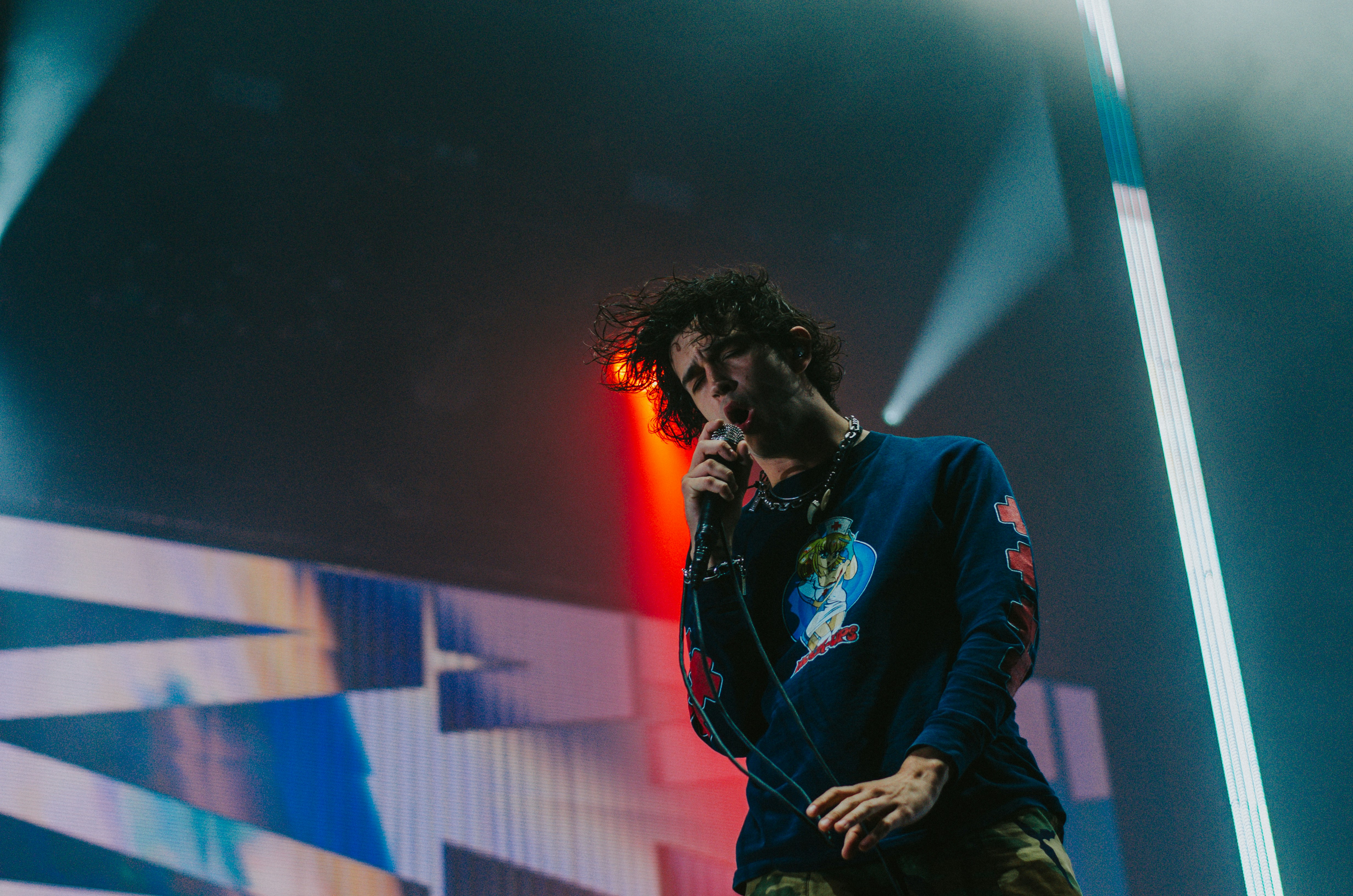 man singing on stage