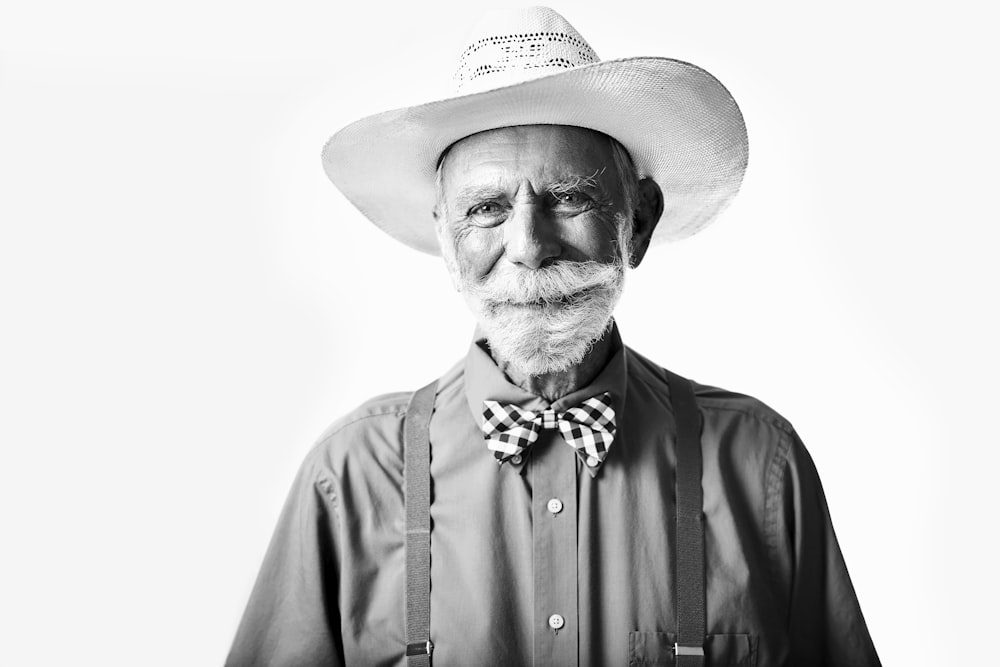 man in collared shirt with cowboy hat